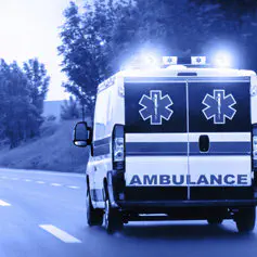 Ambulance van on highway with flashing lights