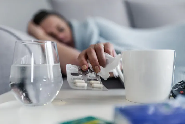 Woman grabbing pills