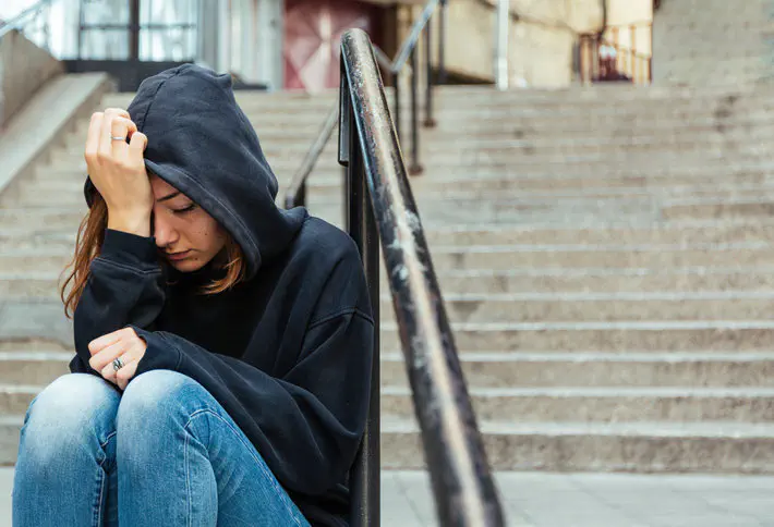 Girl looking impared by cannabis use.