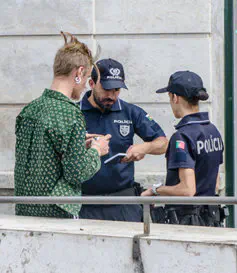 Portuguese police arresting a young man